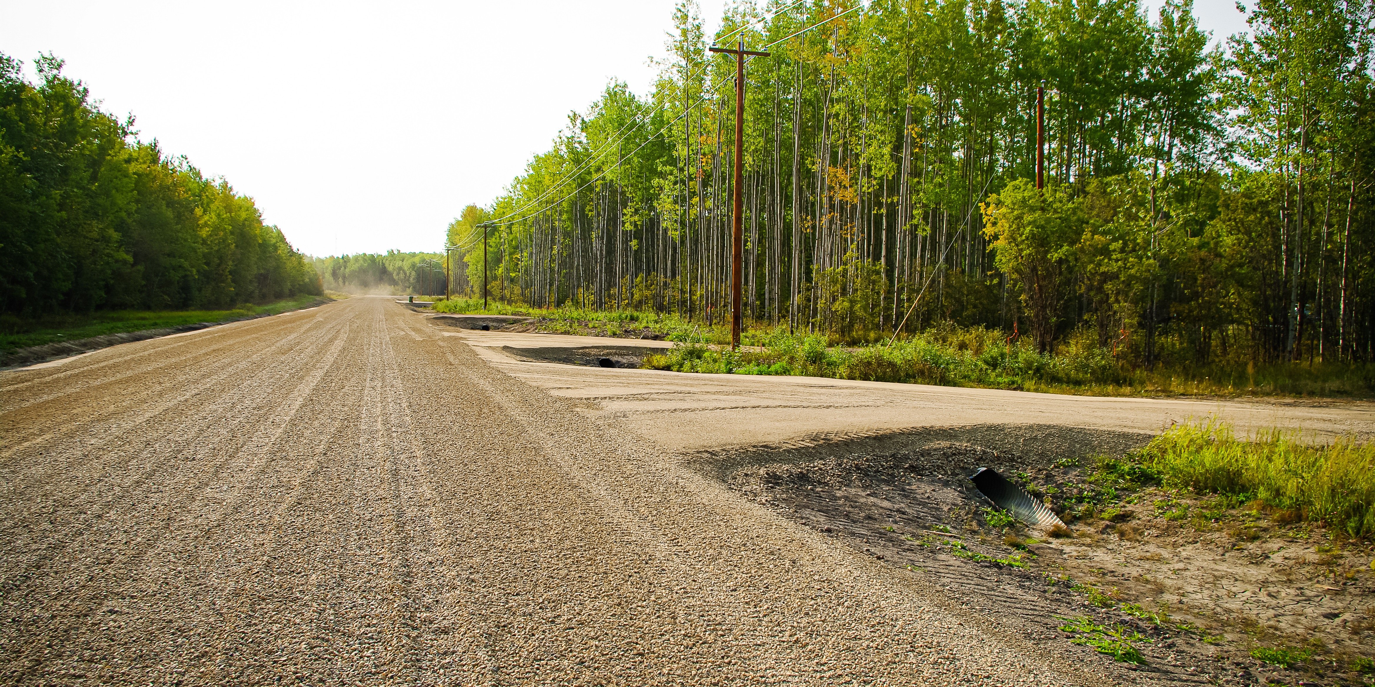 Gravel access road built with Tough Cell geosynthetics.